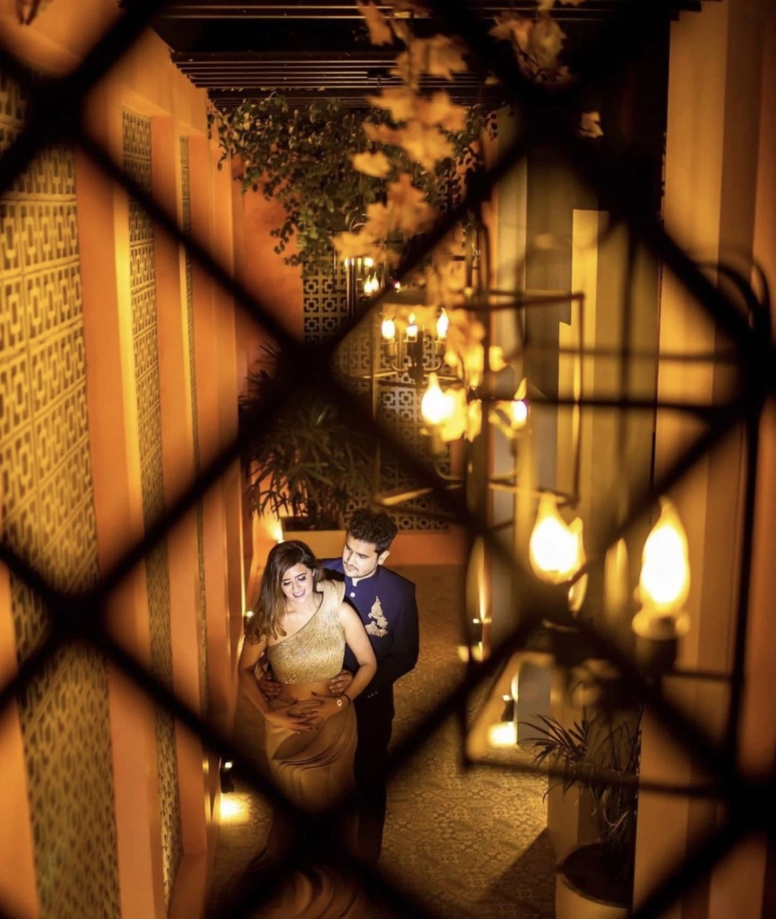 Artistic couple portrait with warm lights by Bright Luxe Salon &amp; Studio, Mahendergarh