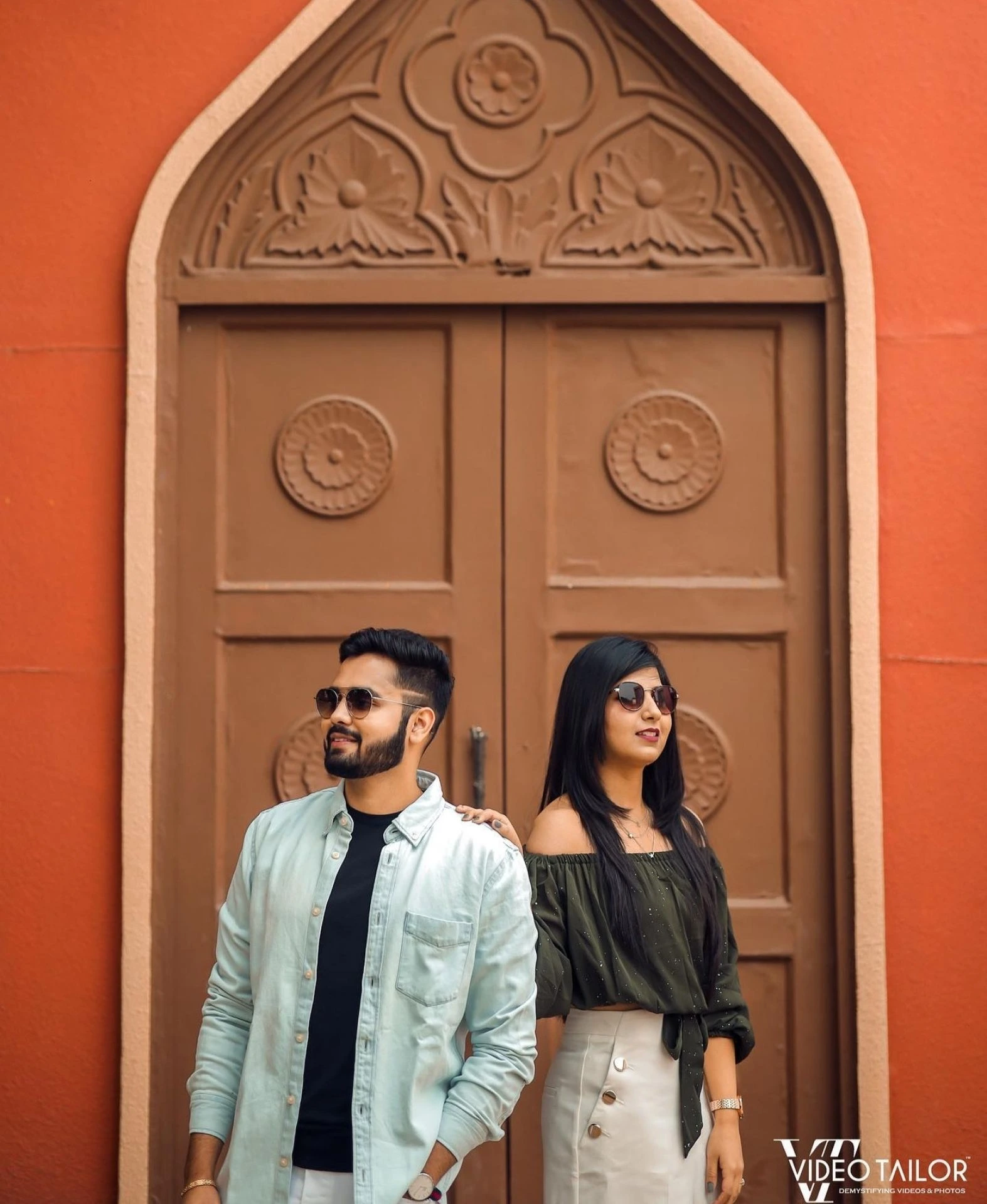 Pre-wedding couple portrait at heritage wooden door by Bright Luxe Salon &amp; Studio, Mahendergarh