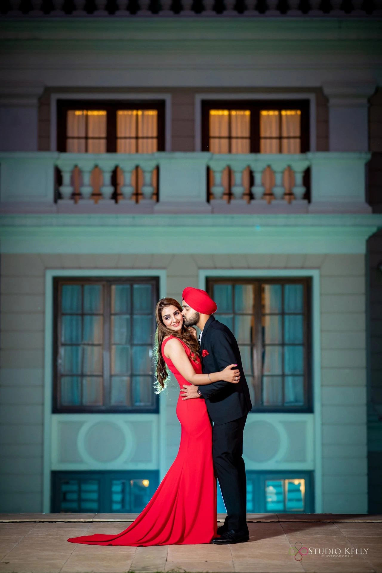 Romantic pre-wedding couple portrait near blue door by Bright Luxe Salon &amp; Studio, Mahendergarh