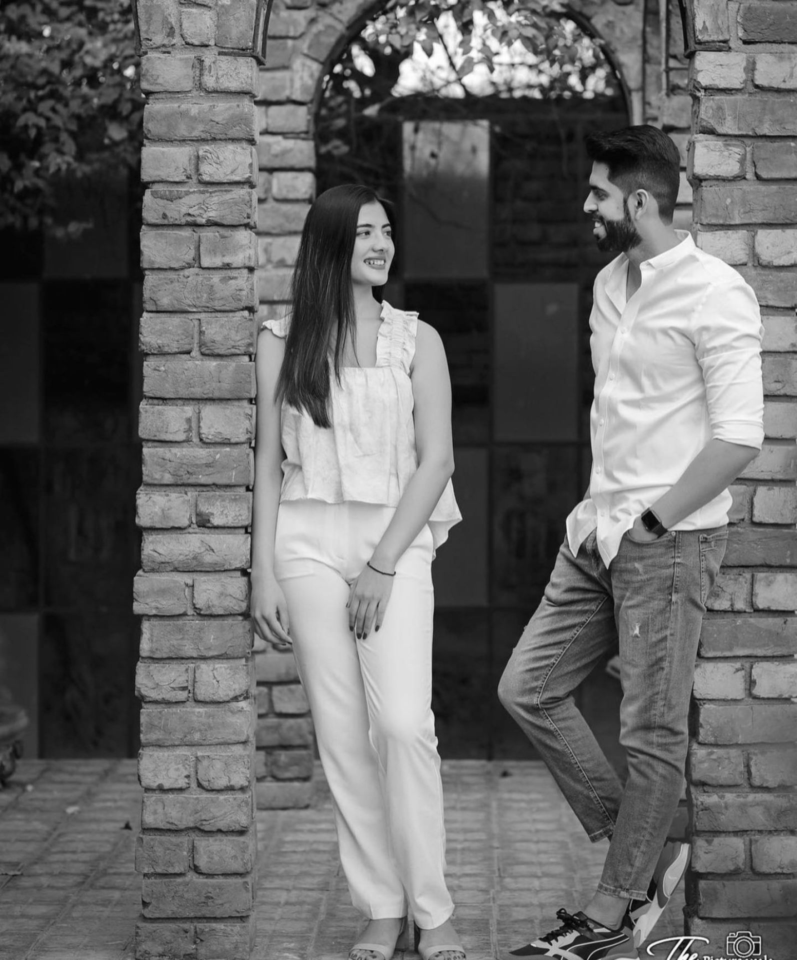 Black and white candid couple photography by Bright Luxe Salon &amp; Studio, Mahendergarh