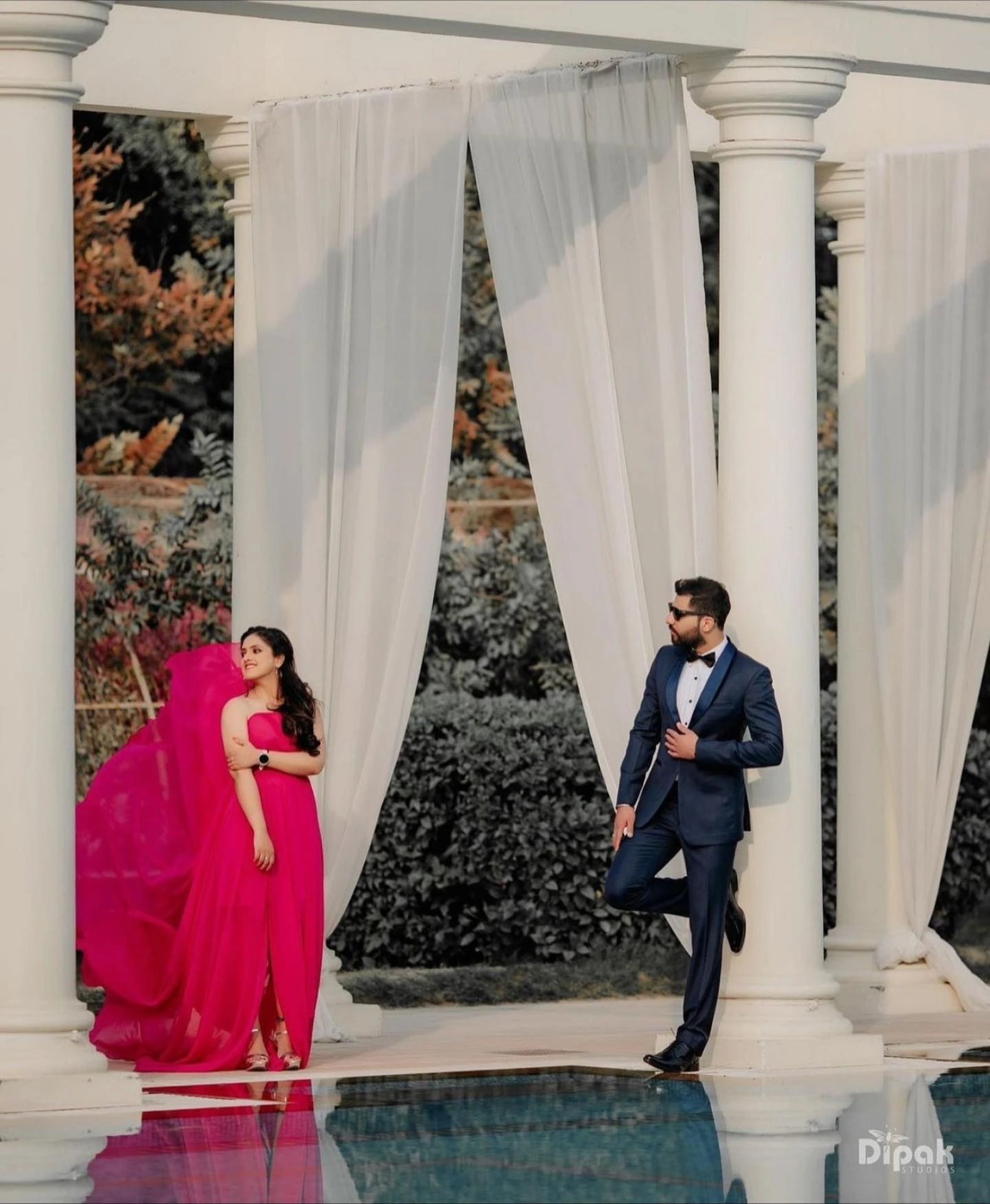 Traditional wedding couple portrait at entrance by Bright Luxe Salon &amp; Studio, Mahendergarh