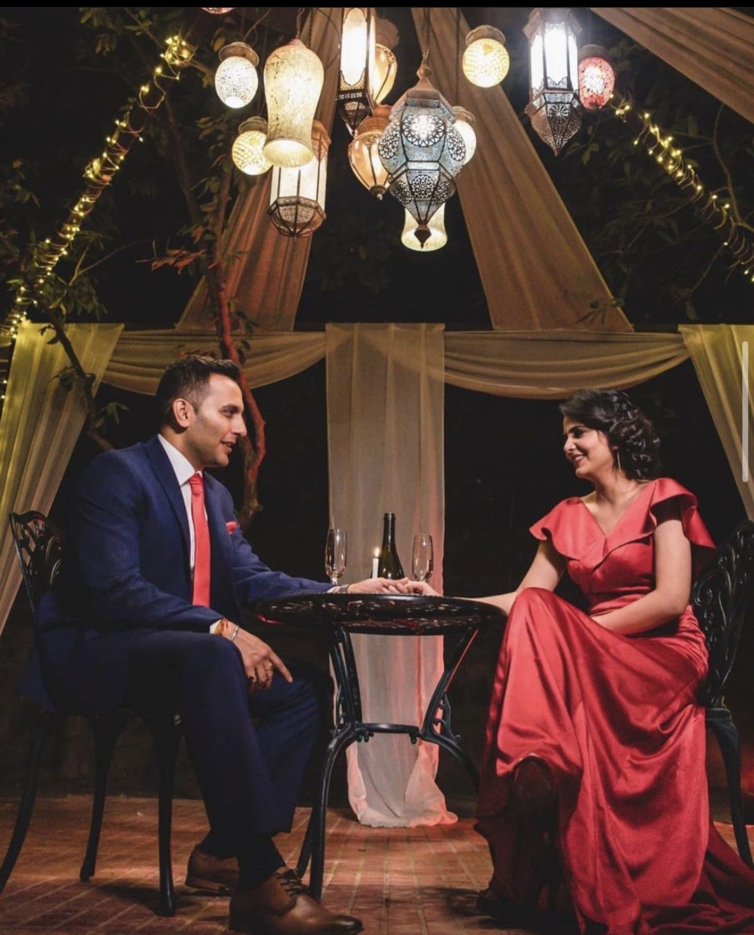 Traditional evening couple portrait under lights by Bright Luxe Salon &amp; Studio, Mahendergarh