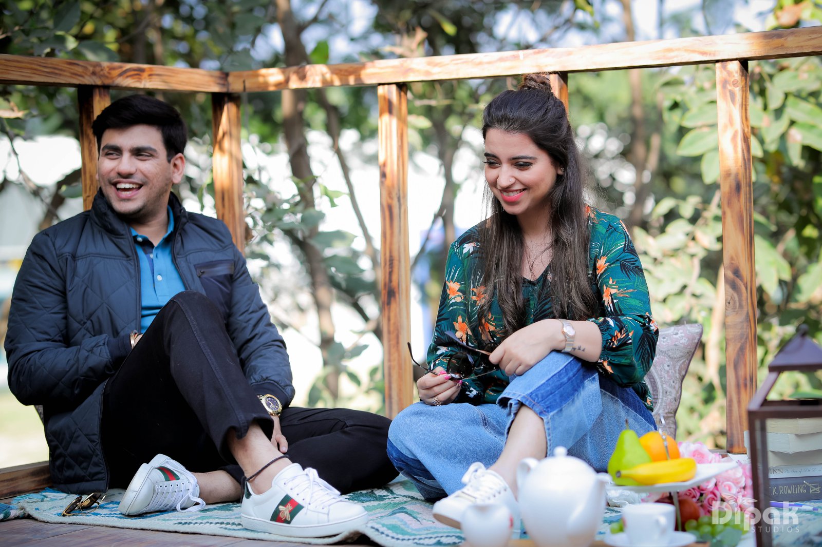 Casual outdoor pre-wedding couple sitting shot by Bright Luxe Salon &amp; Studio, Mahendergarh