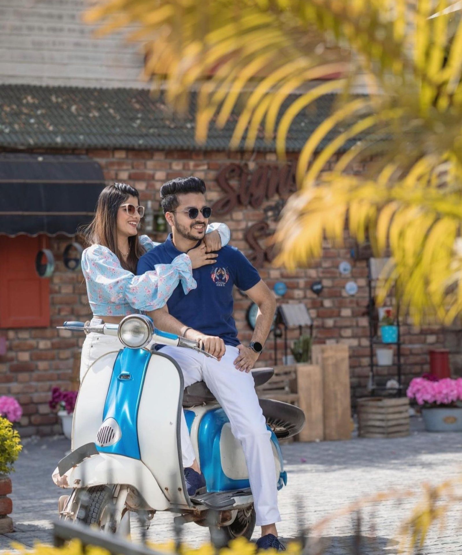 Playful pre-wedding couple photoshoot on scooter by Bright Luxe Salon &amp; Studio, Mahendergarh