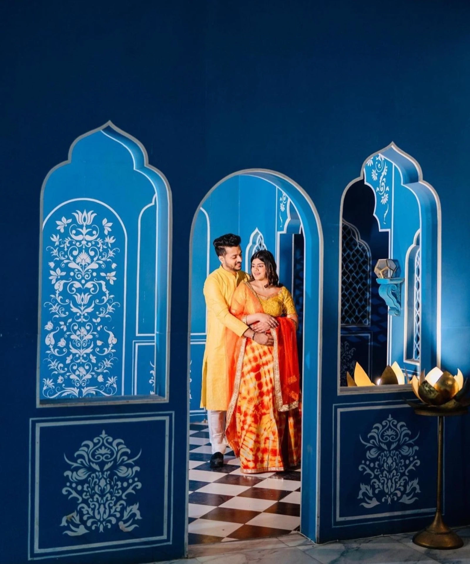 Artistic wedding portrait with blue arches by Bright Luxe Salon &amp; Studio, Mahendergarh